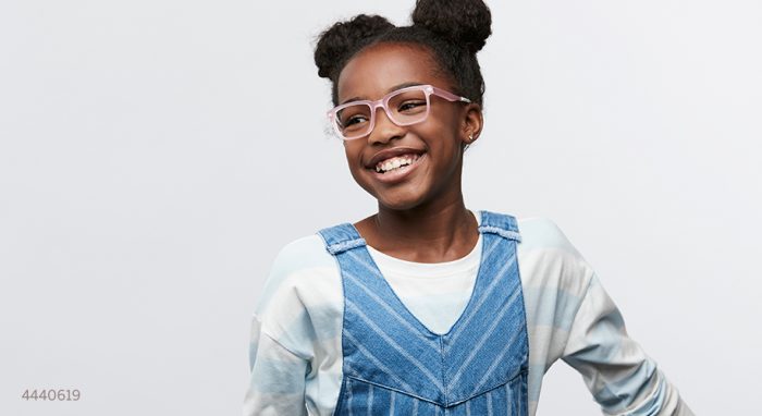 Child wearing light pink eyeglasses with a happy expression. Number 4440619 in the lower-left corner.