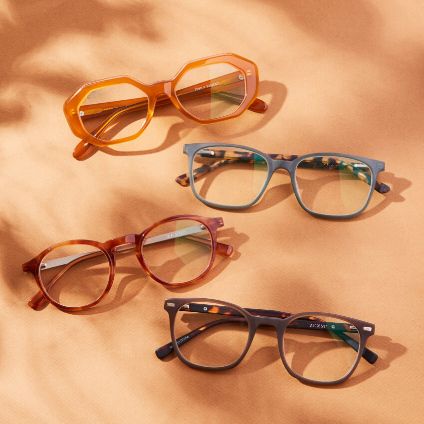 Four pairs of glasses with various frame shapes and colors, including text reading "Timo x Zenni" and "Zenni."