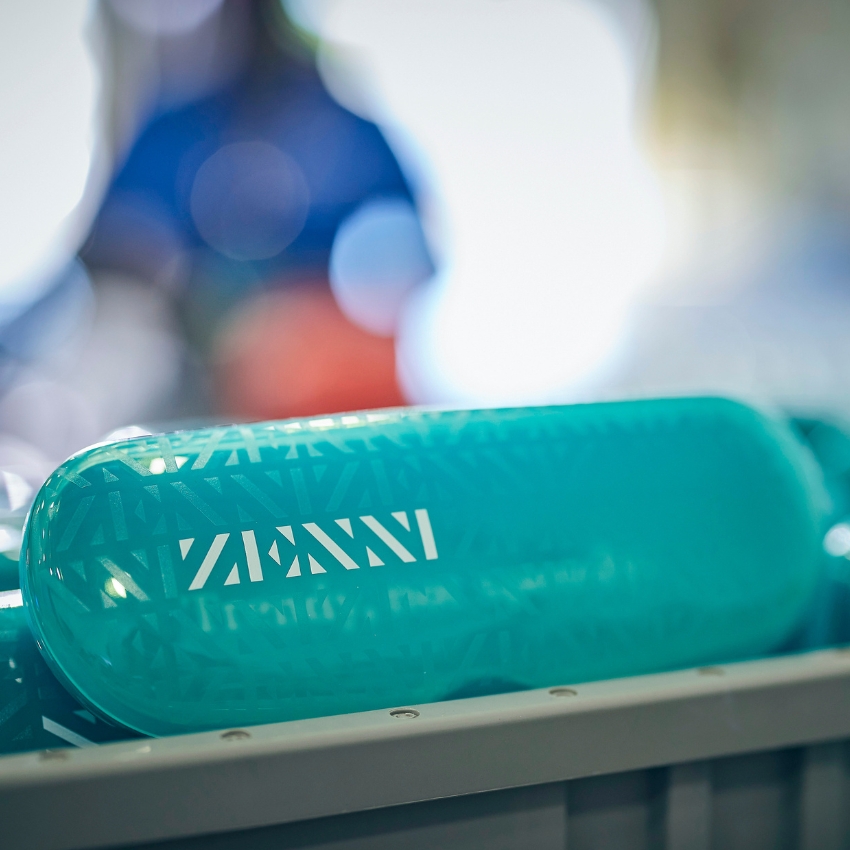 Teal eyeglass case with the word "ZENNI" in white.