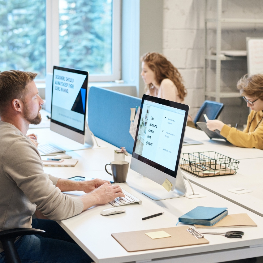 Person working at a computer showing "Use relevant charts and graphs," other text not clear.