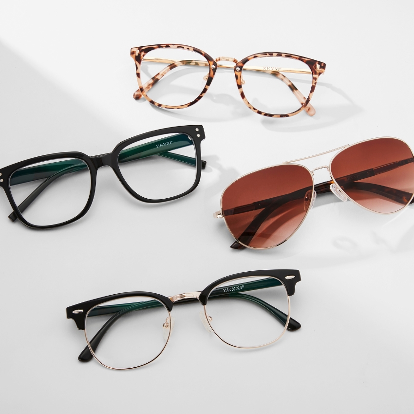 Four pairs of ZENNI eyewear: tortoiseshell round frames, black square frames, gold aviator sunglasses, and half-rim glasses with black tops and gold rims.