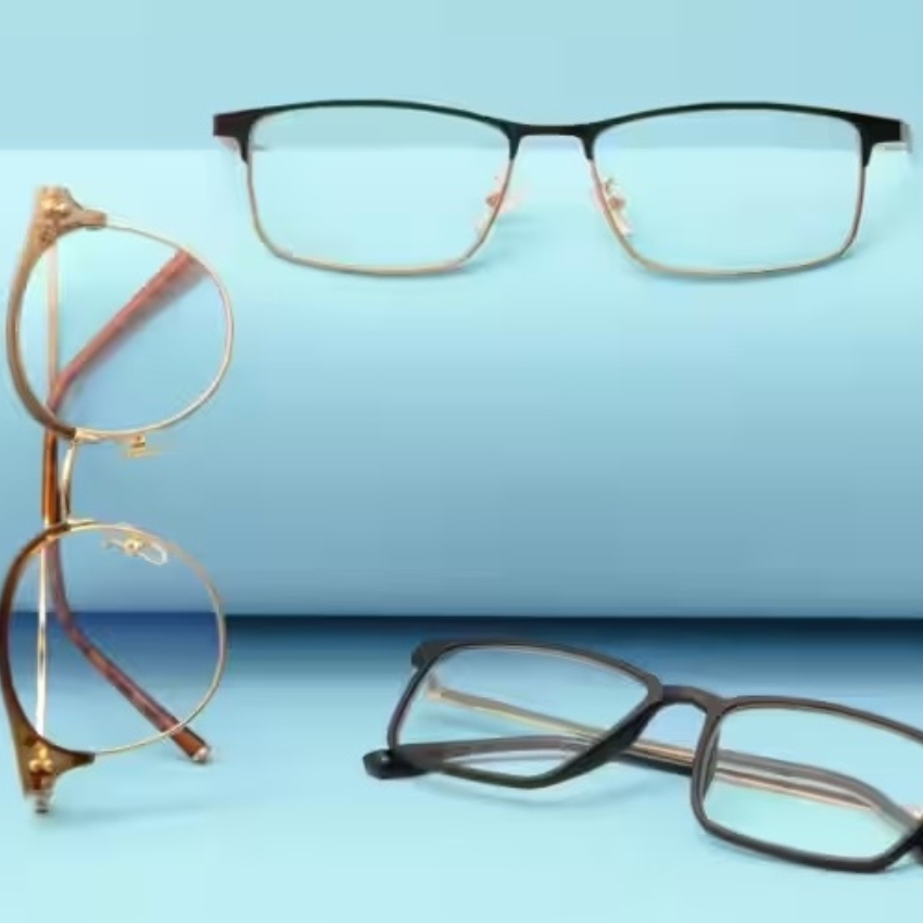 Three pairs of eyeglasses with different frames: black rectangular, gold round, and black rectangular.