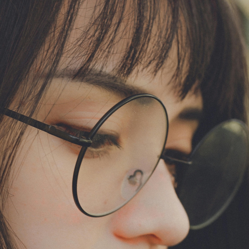 Black round eyeglasses with metallic frame.