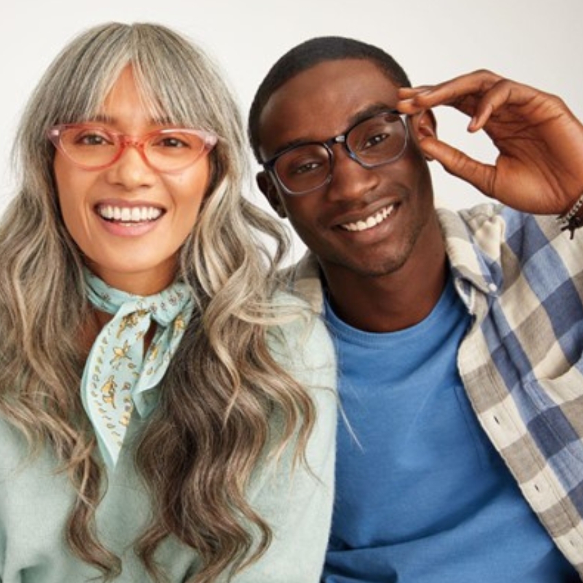 Man and woman wearing stylish eyeglasses, both smiling and showcasing different frame styles.