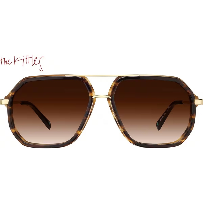 The Kittles sunglasses with brown gradient lenses and tortoiseshell frames, gold accents on the bridge and temples.