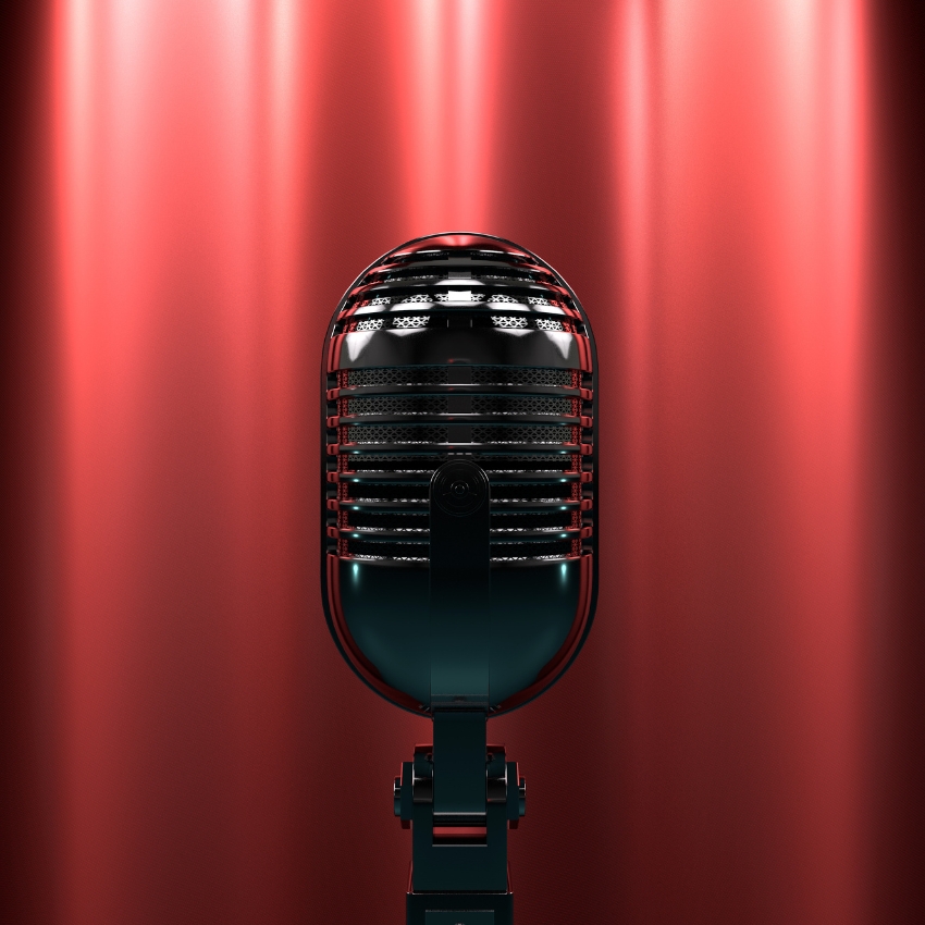 Retro-style black microphone with a red backdrop.