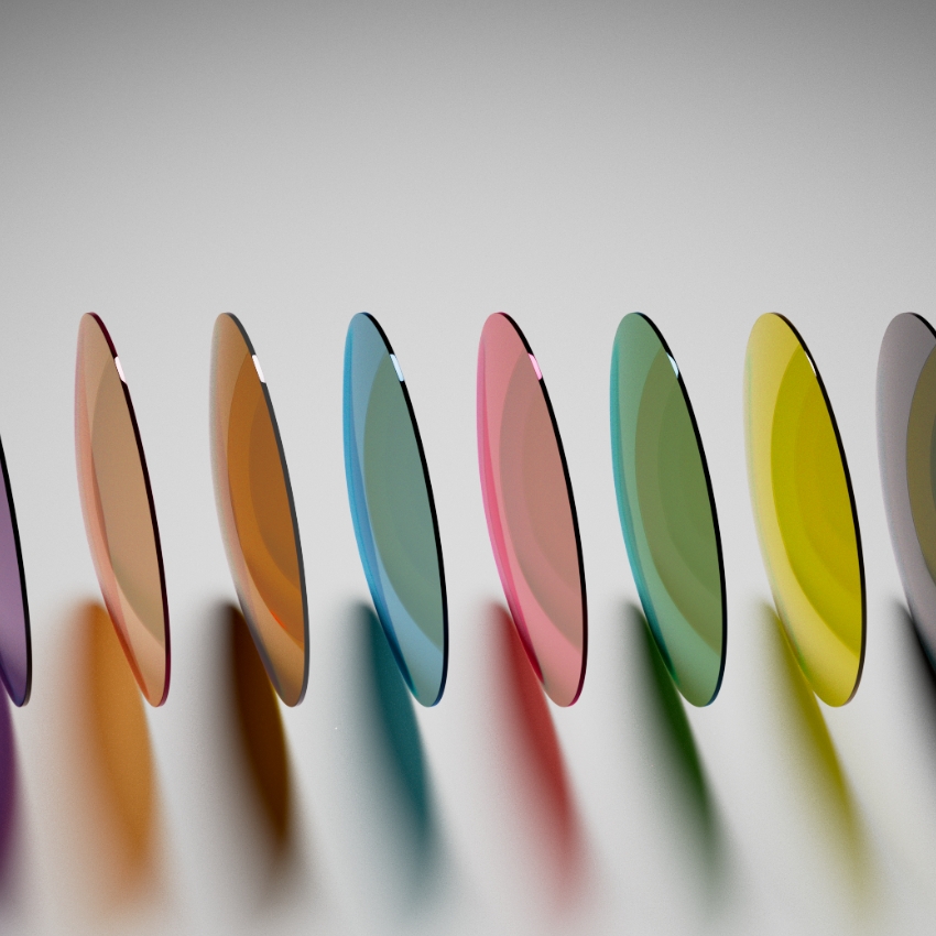 Colorful eyeglass lenses arranged vertically, displaying a gradient of hues from purple to yellow.