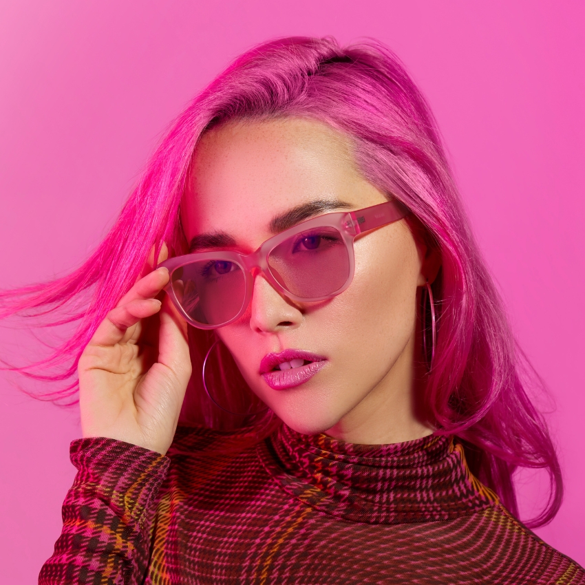 Pink gradient sunglasses with a thick frame.