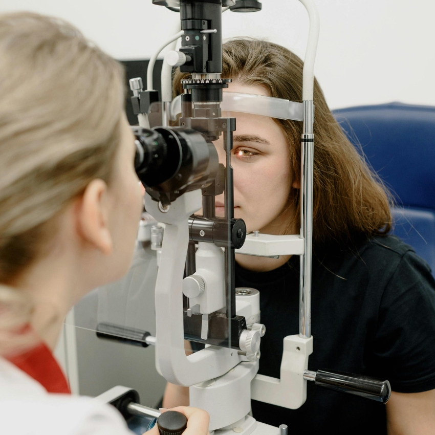 Eye examination using a slit lamp biomicroscope.