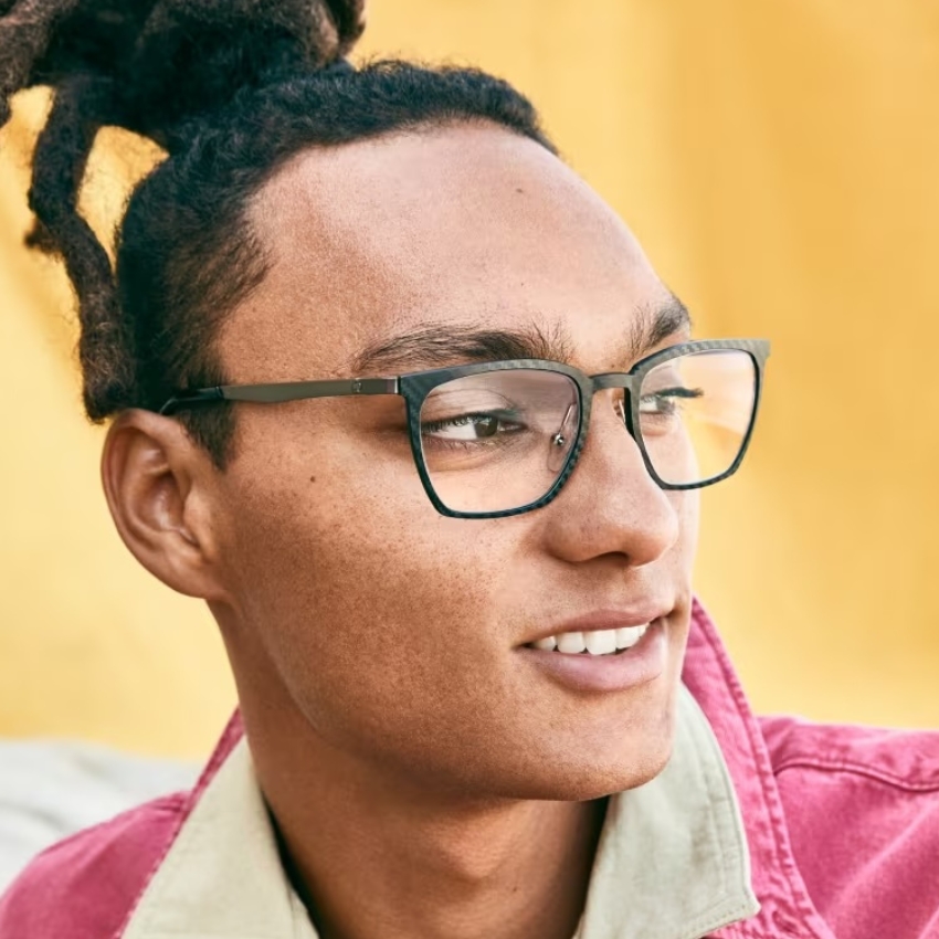 Person wearing black rectangular eyeglasses.