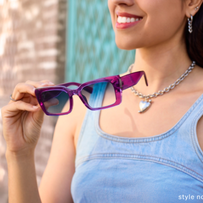 Woman holding purple sunglasses with blue lenses. Text in image: "style no.x."