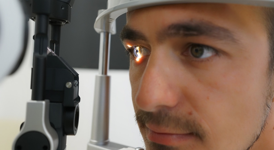 Person in slit lamp getting eye exam