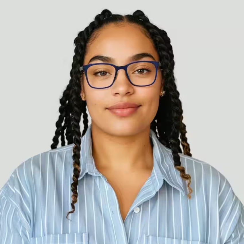 Woman wearing blue-framed eyeglasses and a light blue, striped button-up shirt.