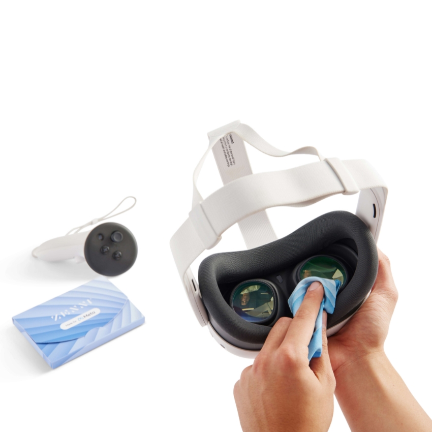 VR headset being cleaned with a cloth. Includes a remote and a packet labeled "VR Headset Cleaning Wipes".