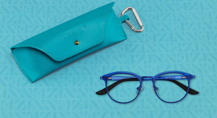 Blue eyeglasses with text &#039;ZENNI&#039; on frame, paired with a turquoise leather case embossed with &#039;ZENNI&#039;.