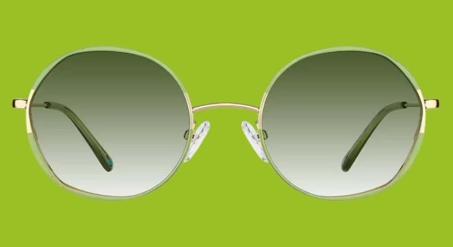 Round sunglasses with gold frames and gradient green lenses on a lime green background.