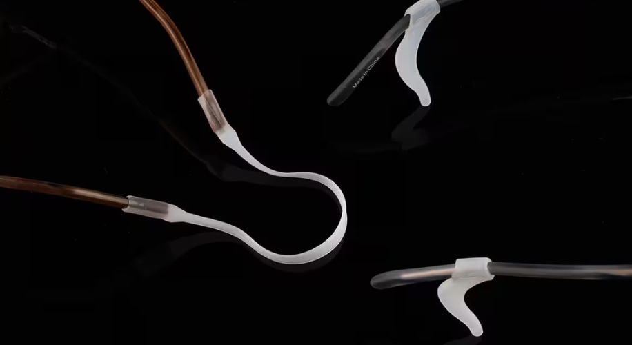 Flexible tube nasal cannula with soft, curved prongs on a black background.