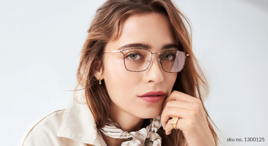 Rectangular eyeglasses with thin gold frames, slightly tinted lenses. SKU no. 1300125.