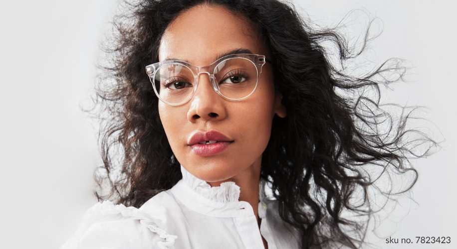 Clear eyeglasses frames worn by a person with flowing hair; sku no. 7823423.