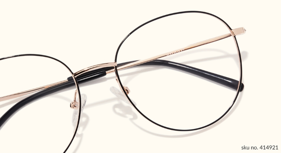 Round metal frame eyeglasses with black rims and clear nose pads. Text: &quot;sku no. 414921&quot;.