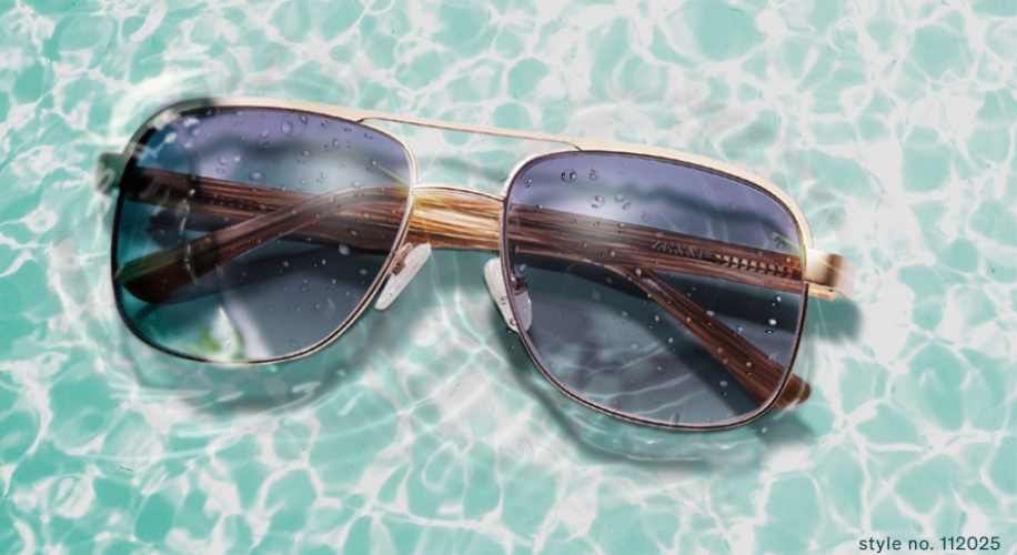 Gold-rimmed sunglasses with dark lenses and water droplets. Style no. 112025.