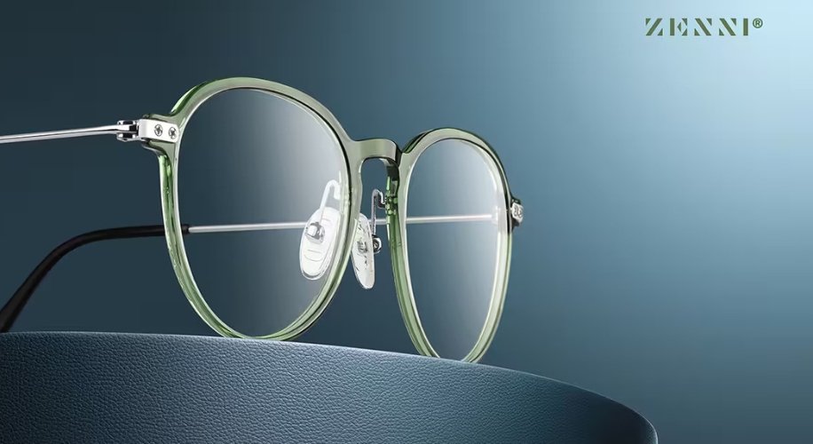 Green-rimmed eyeglasses with clear lenses. &quot;ZENNI&quot; text on the top right.