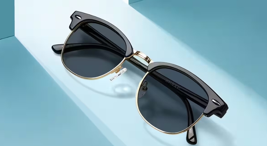 Black and gold frame sunglasses with dark lenses.