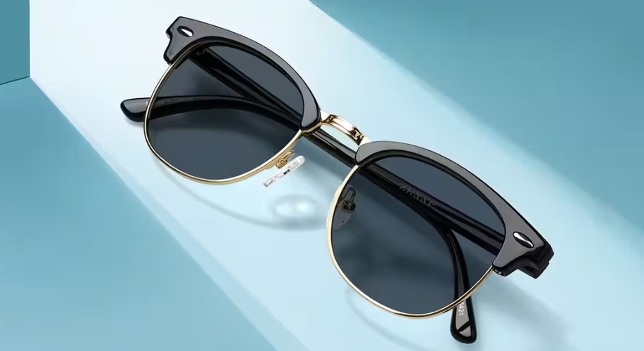 Classic black and gold sunglasses with round lenses and metal accents.