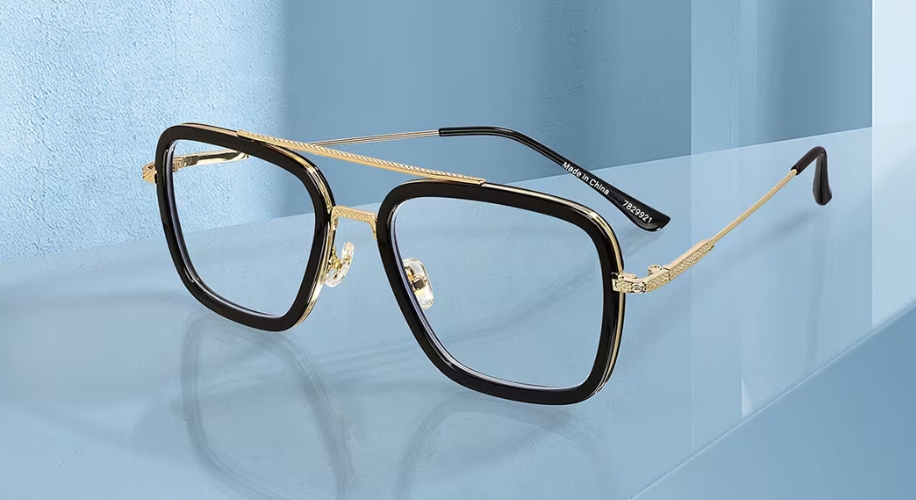 Square-shaped glasses with a black and gold frame. The temple arm text reads &quot;Made in China 7209021.&quot;