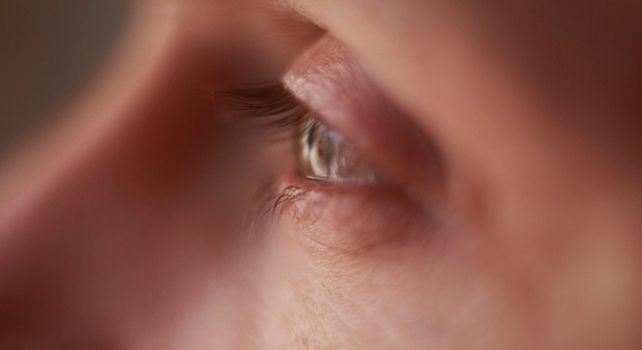 Close-up of a human eye looking to the right.