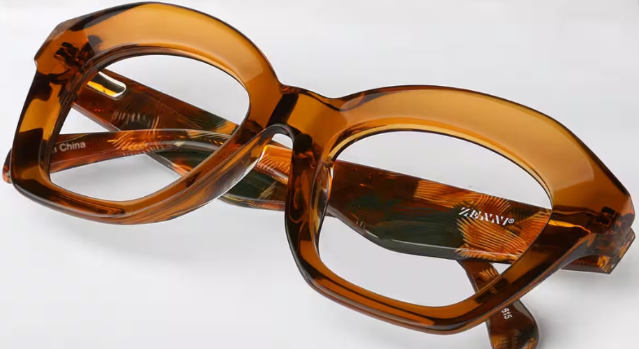 Brown, oversized eyeglasses with a patterned inner frame. Text on the temple reads &quot;ZRENJI&quot;.