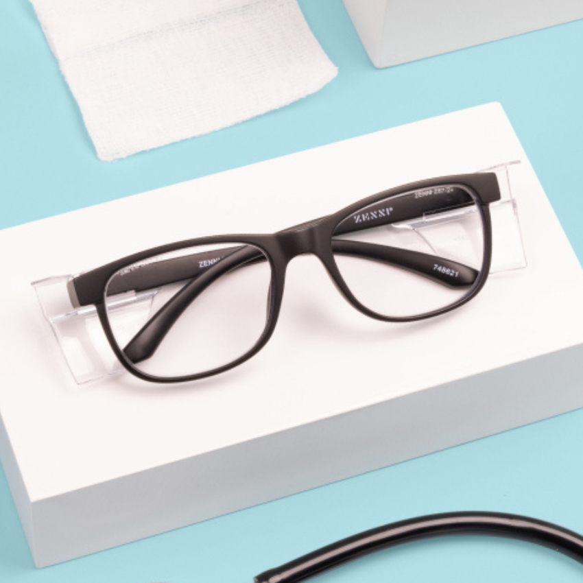 Black rectangular eyeglasses with the text "ZENNI" and "748627" on the inner arms displayed on a white box.