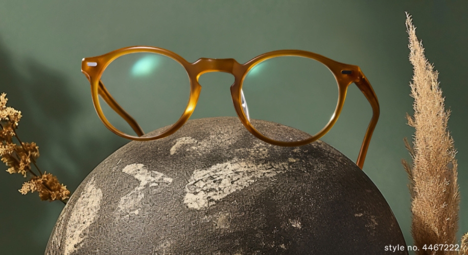 Round tortoiseshell eyeglasses perched on a textured sphere. Text: style no. 4467222.