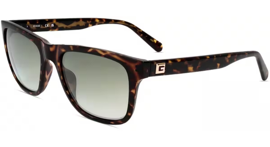 Tortoiseshell sunglasses with a &quot;C&quot; logo on the temple; GUESS and CE text inside the left arm.