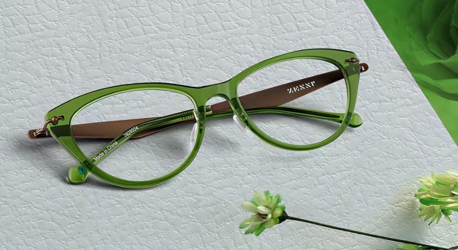 Green cat-eye glasses with text &quot;ZENNI&quot; on lens and &quot;Made in China – 128921&quot; on the arm.