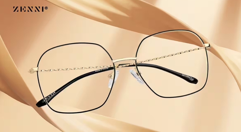 Zenni rimless glasses with gold wire frames and black arms. Text: ZENNI, Made in China, 8218801.