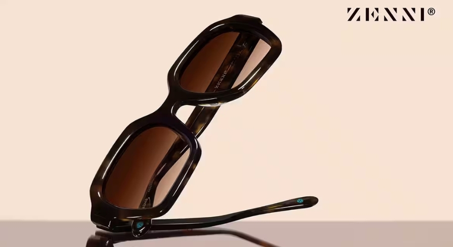 Zenni rectangular tortoiseshell sunglasses with brown lenses, hinged on a reflective surface. Text: ZENNI®.