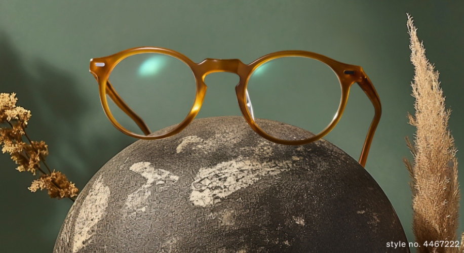 Vintage-style amber glasses with round frames resting on a stone sphere. style no. 4467222