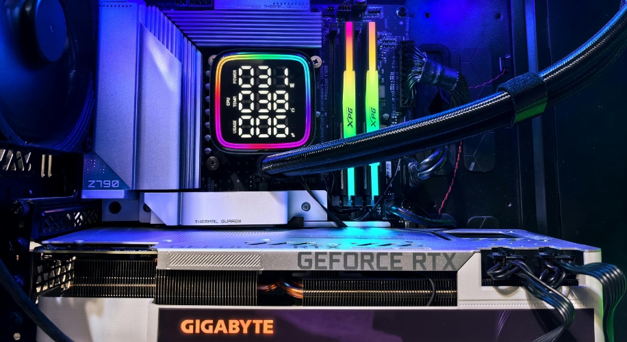 High-end gaming PC with Gigabyte GeForce RTX graphics card, XPG RAM, and Z790 motherboard. Display shows 26°C.