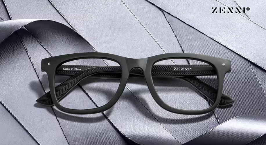 Black eyeglasses with textured arms, text reads &quot;Made in China&quot; and &quot;ZENNI®&quot; on a silver background.