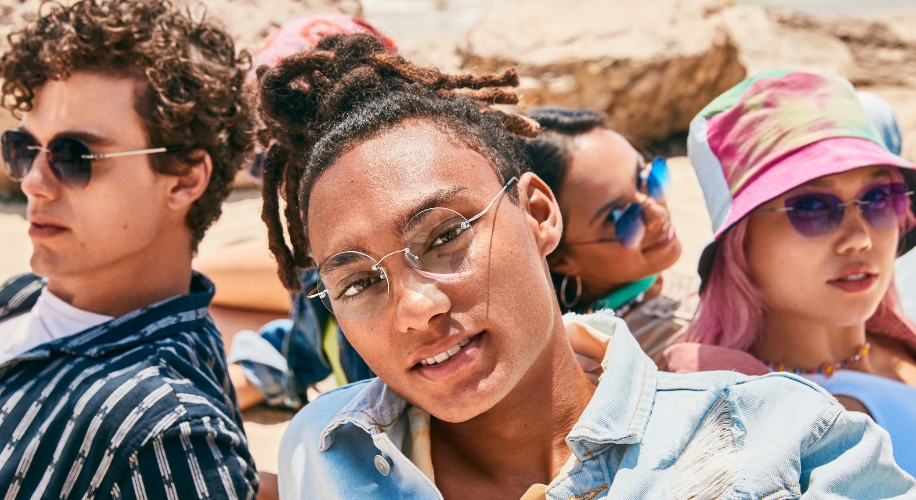 Group of people wearing stylish sunglasses and casual clothing.