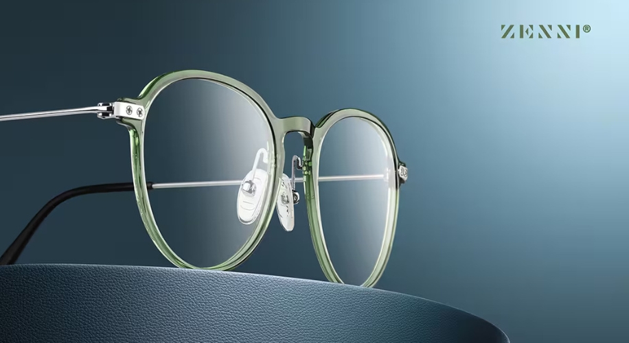 Transparent green round eyeglasses with silver temples. Text: ZENNI®.