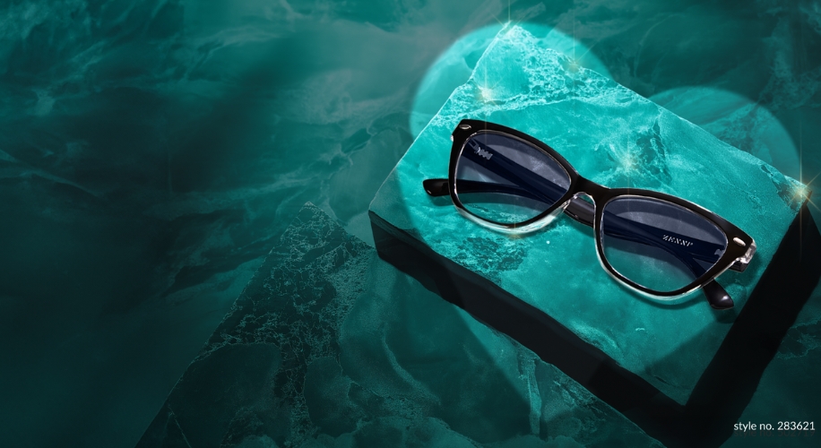 Black-framed sunglasses on a green marble surface; text: style no. 283621.