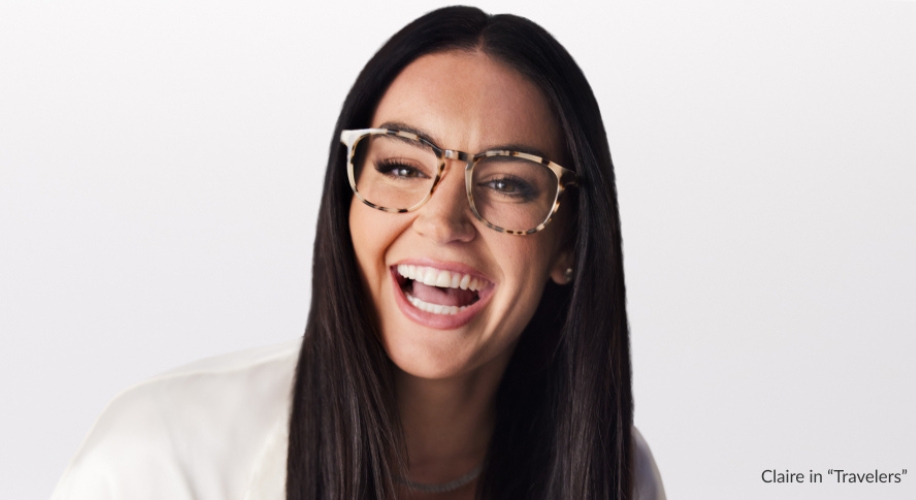 Woman wearing tortoiseshell glasses, smiling. Text: Claire in “Travelers”.