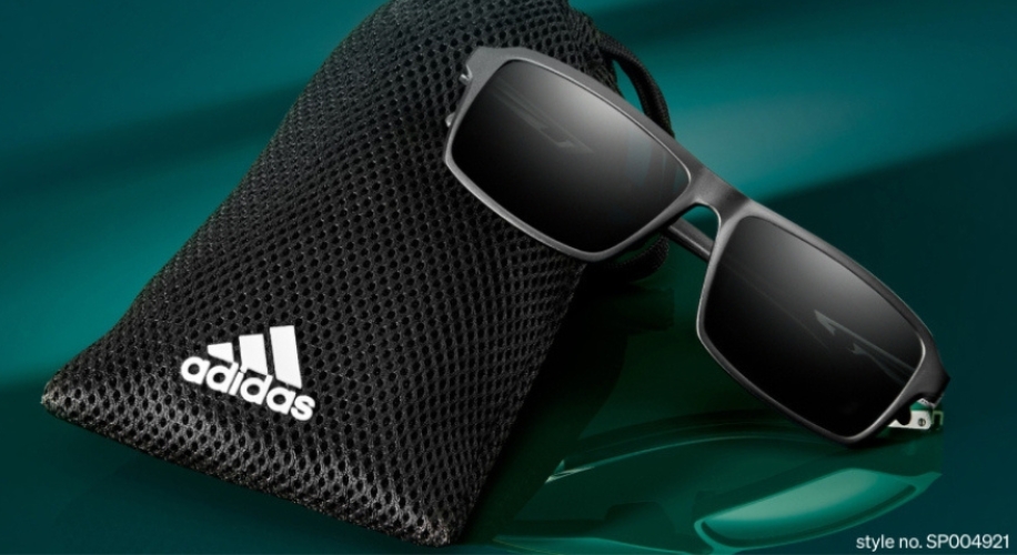 Adidas sunglasses with black mesh case. Style no. SP004921.