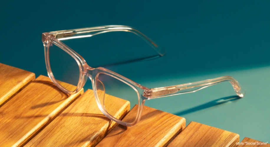 Clear eyeglasses on a wooden surface. Style &quot;Social Scene&quot;.