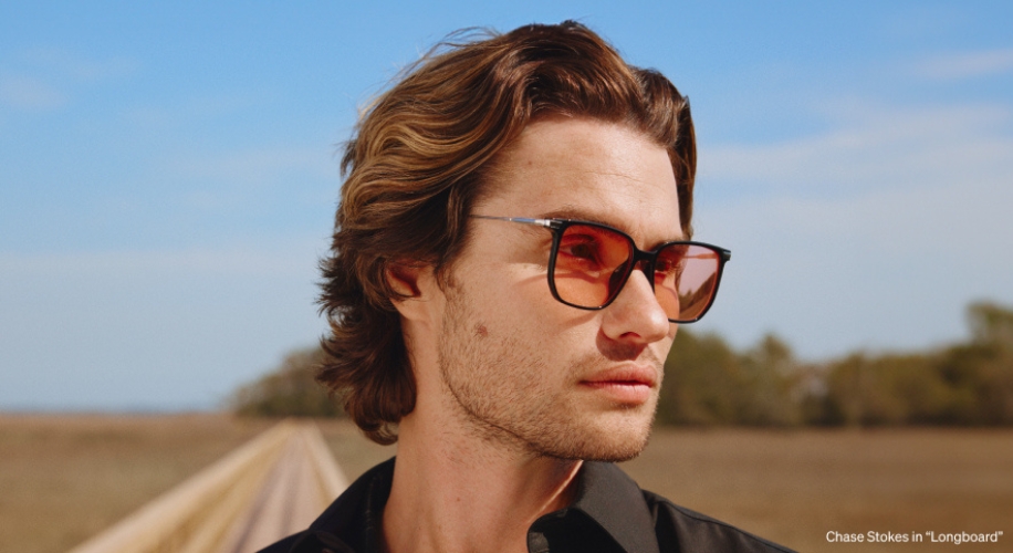 Sunglasses with brown lenses and tortoiseshell frame. Text: Chase Stokes in &quot;Longboard&quot;.