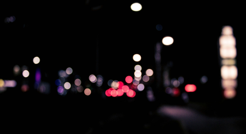 Blurred bokeh city lights at night.