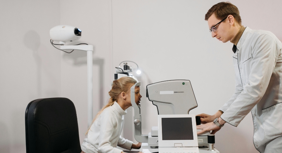 Optometry exam with autorefractor in use.