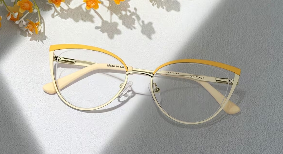 Cat-eye glasses with yellow top rims, text &quot;Made in China&quot; and &quot;ABBENNY&quot; on the arms.